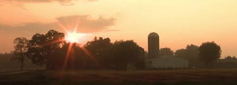 farm with buildings and grain bin