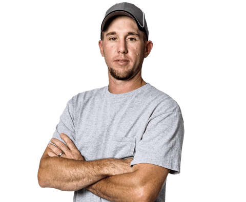 man posing in gray shirt and hat