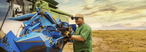 man working on combine