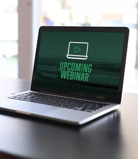 laptop computer with upcoming webinar on the screen