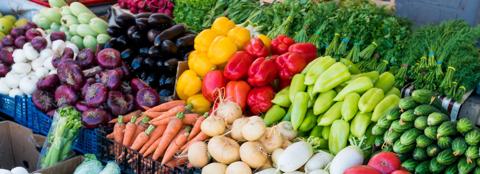 closeup of vegetables displayed at a farmers' market