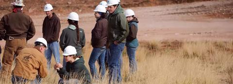 students engaging in studying and looking at ranchland